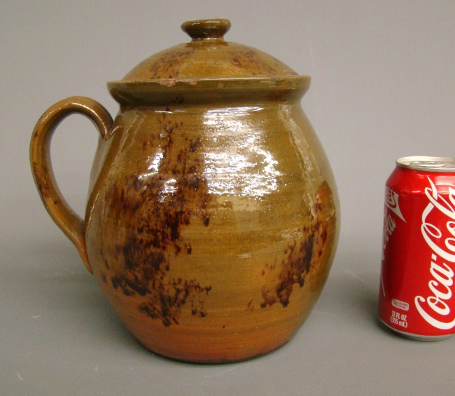Penna. redware jar with lid. 9''