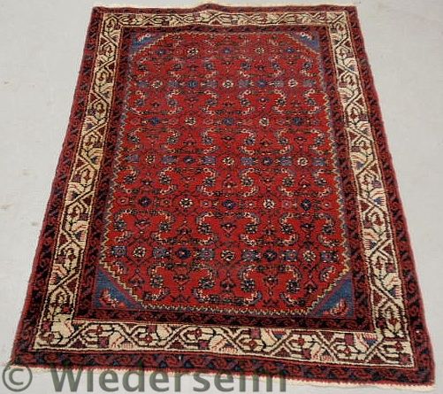 Persian mat with a red field