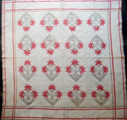 Pieced and appliqued cotton quilt