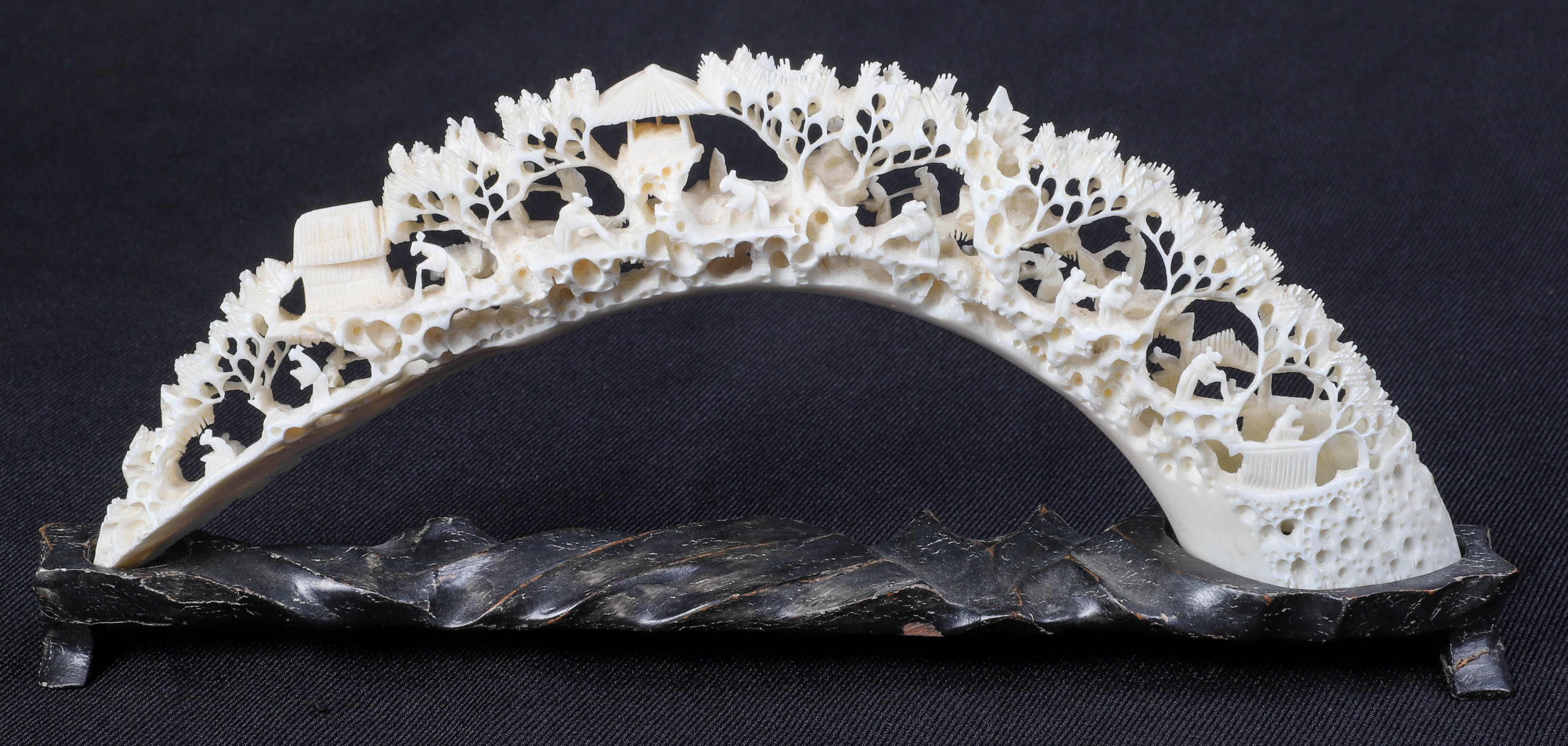 Pierced and carved scenic ivory, in