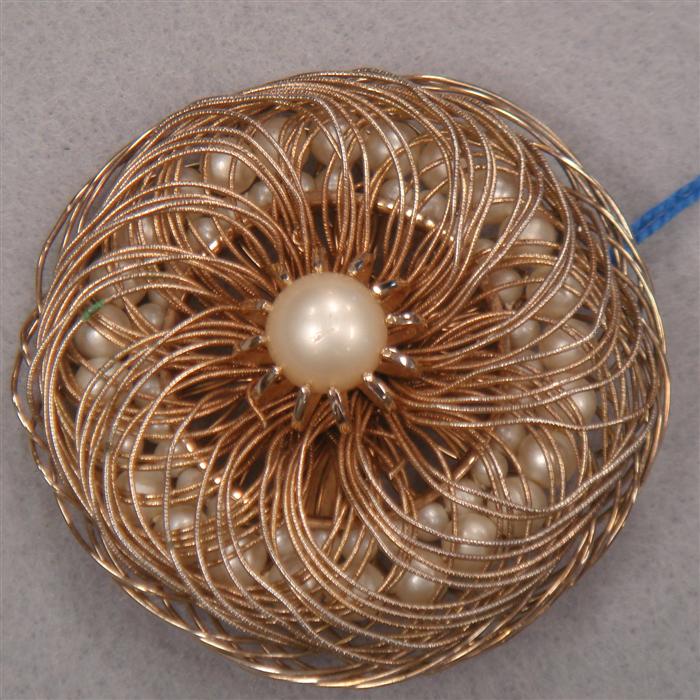 Pin fashioned of wire and faux