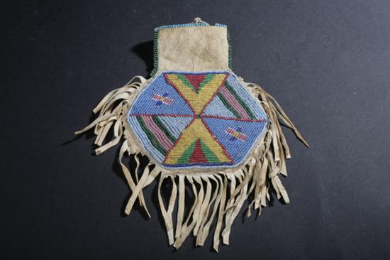 PLAINS TRIBE BEADED BUCKSKIN POUCH.