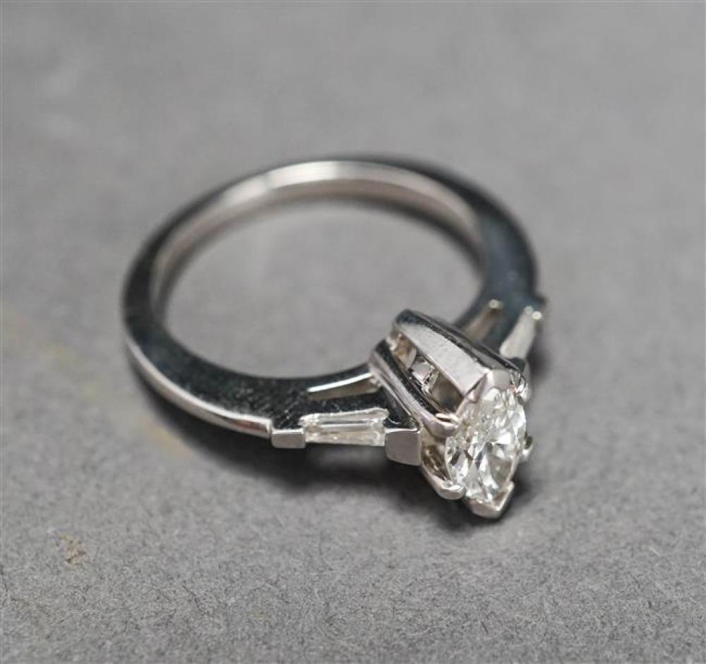 PLATINUM AND MARQUISE DIAMOND RING,