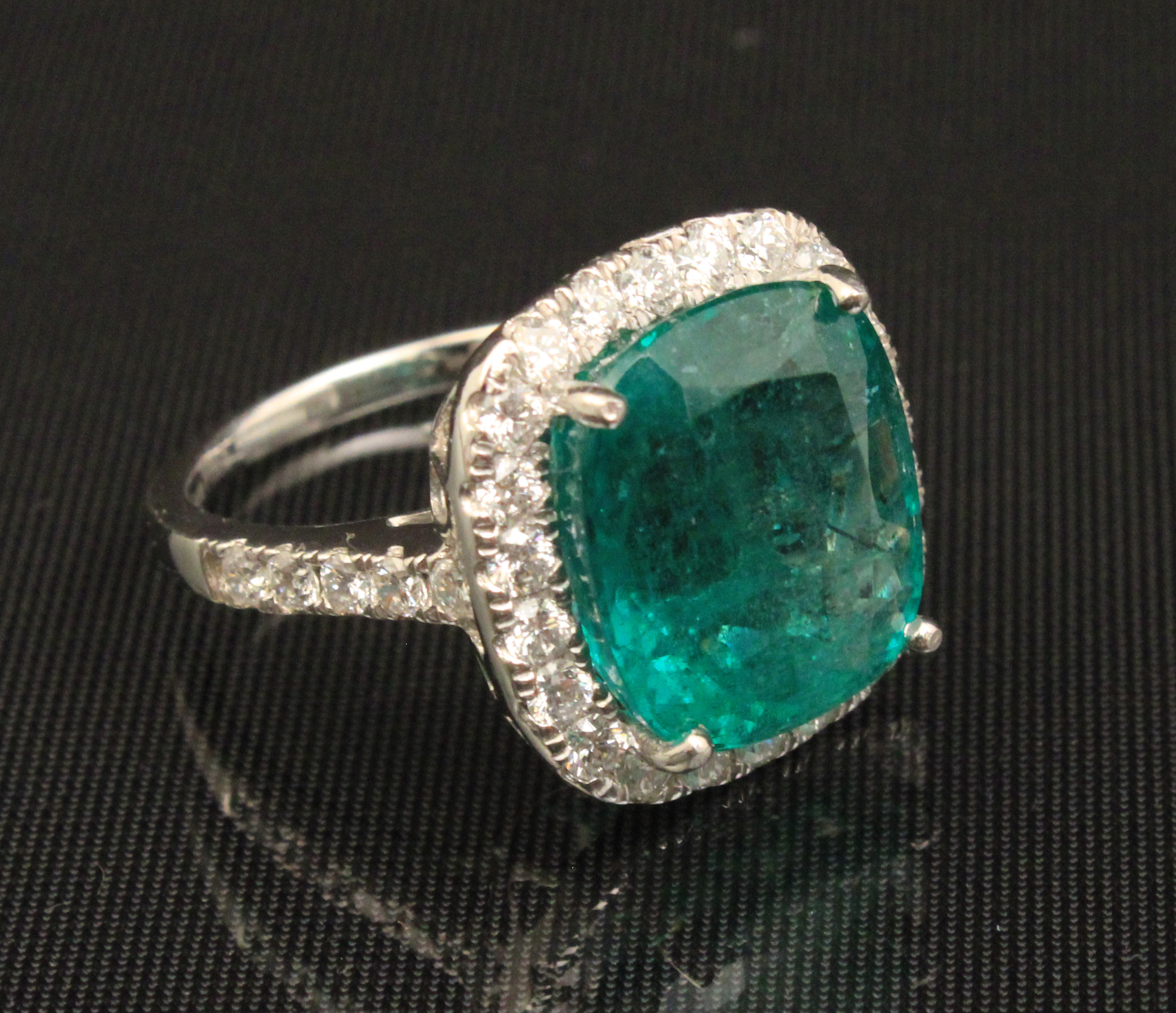 PLATINUM EMERALD AND DIAMOND RING