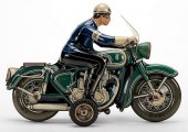POLICEMAN ON A GREEN MOTORCYCL