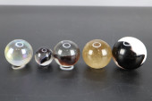POLISHED GLASS ORBS, GROUP OF