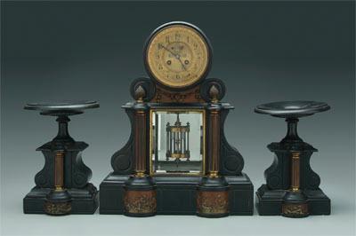Polished slate clock and garniture,