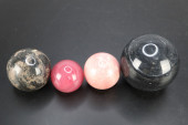 POLISHED STONE ORBS, GROUP OF