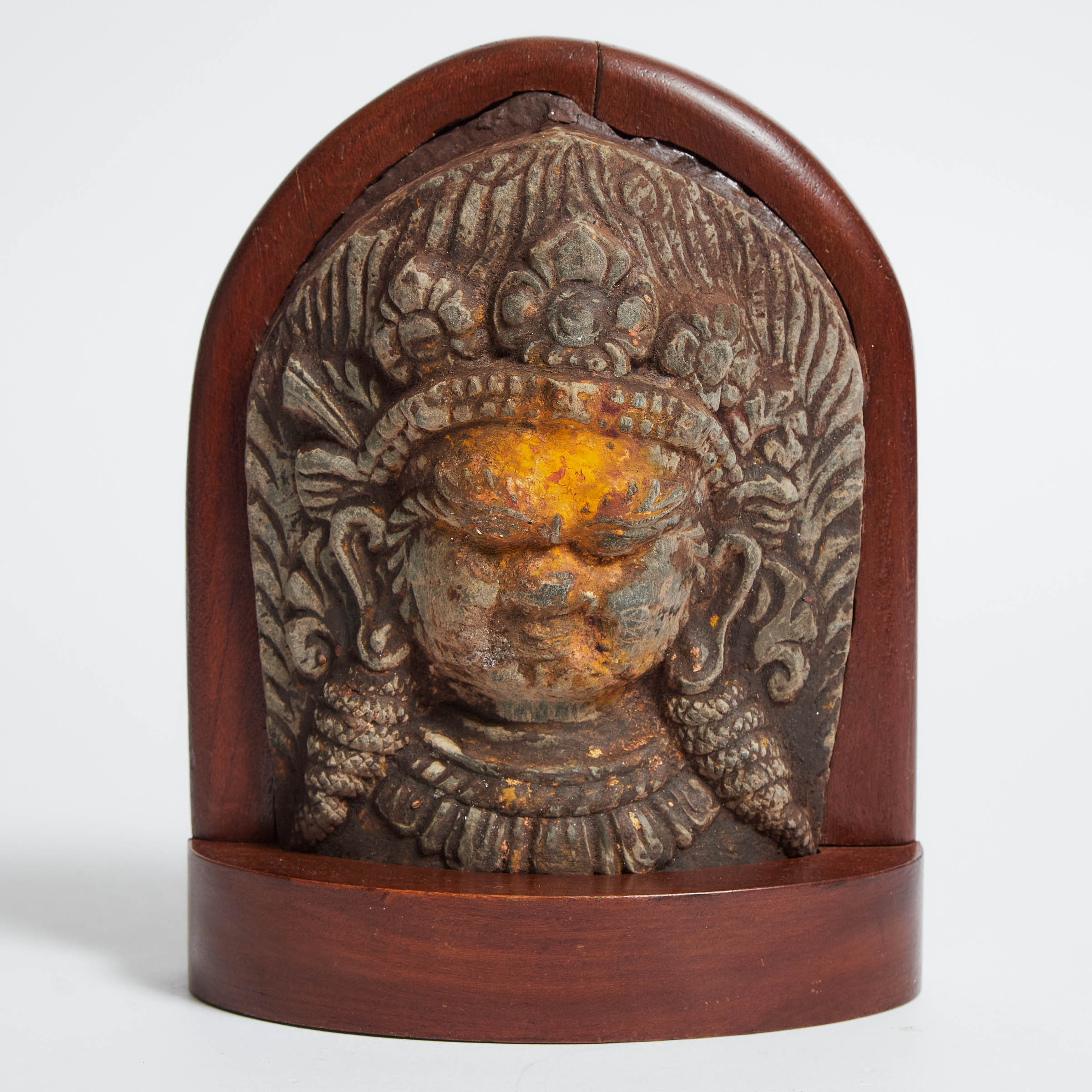 Polychromed Limestone Mask Stele of