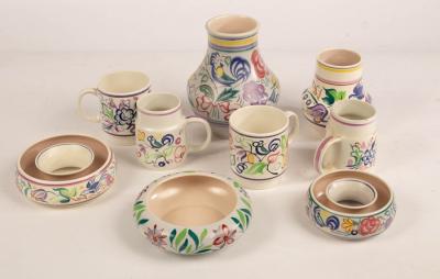 Poole Pottery, four floral mugs,