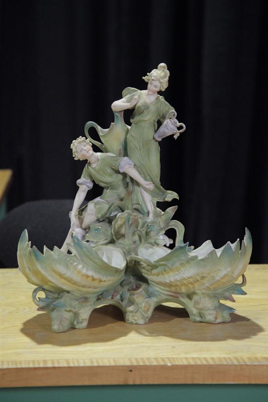 PORCELAIN FIGURAL CENTERPIECE.