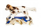 PORCELAIN FIGURE OF A COCKER S