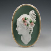 Porcelain wall plaque with wom