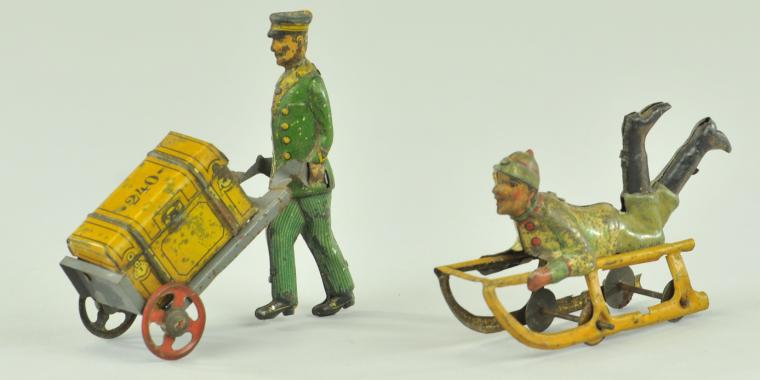 PORTER WITH LUGGAGE & BOY ON SLED