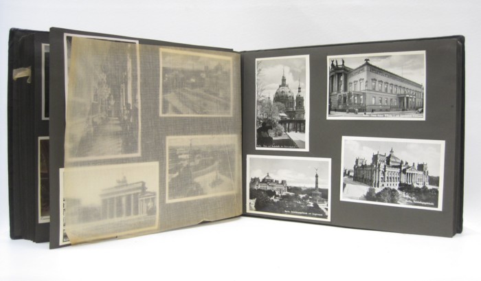 POSTCARD ALBUM containing more than
