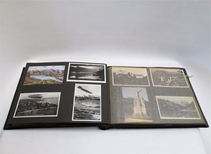 POSTCARD ALBUM containing more than