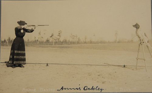 POSTCARD OF ANNIE OAKLEY SHOOTING
