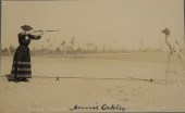 POSTCARD OF ANNIE OAKLEY SHOOT