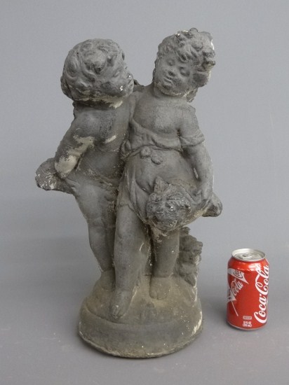 Poured stone fountain two boys.