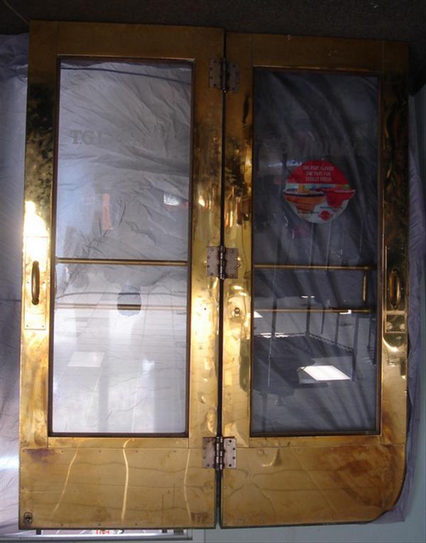 Pr brass clad mahogany entry doors,