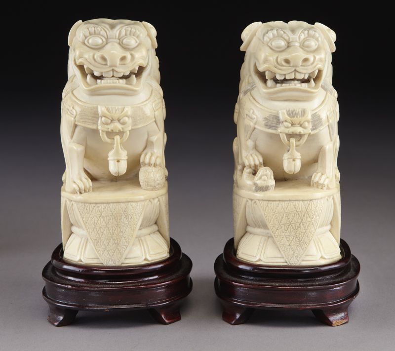 Pr. Chinese carved ivory foo dogs