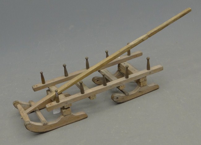 Primitive child' s sled.