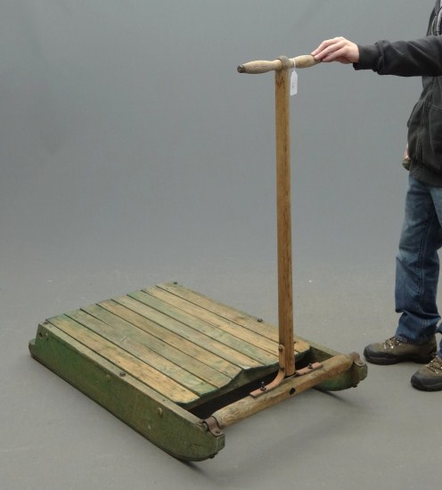 Primitive painted pull sled.