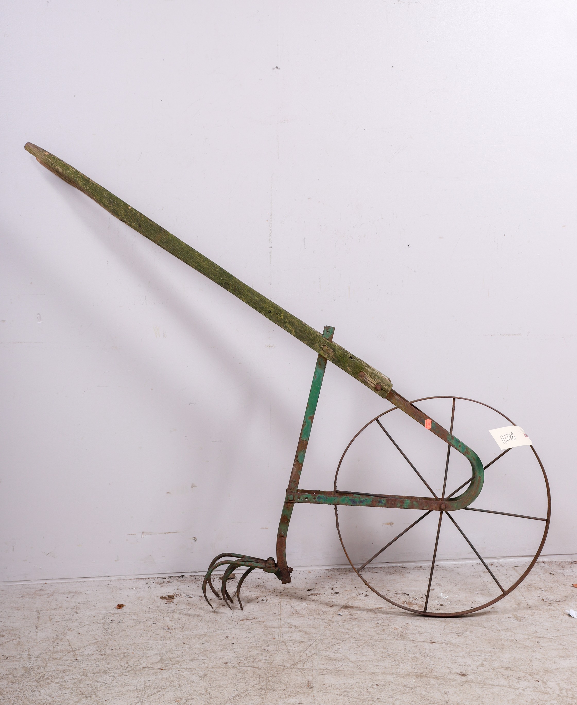 Primitive wood and metal plow,
