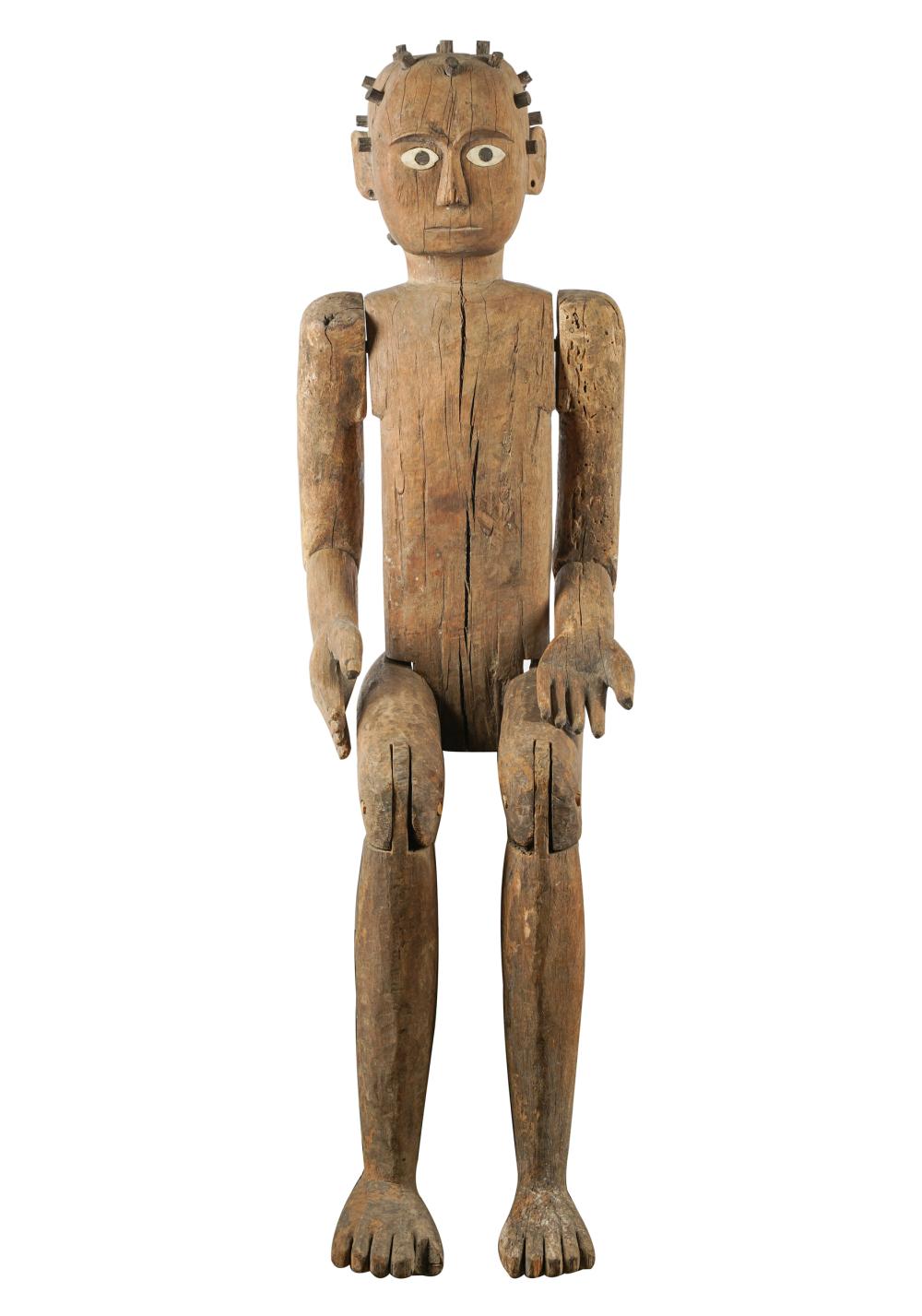 PRIMITIVE WOODEN FIGURE OF A SEATED
