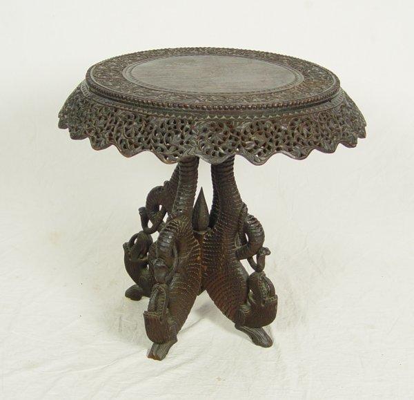 PROFUSELY CARVED AND PIERCED