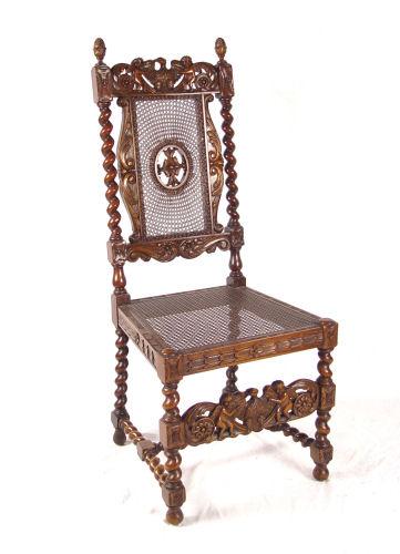 PROFUSELY CARVED CANED CHAIR: Top