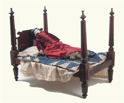 Queen Anne-style doll bed with doll