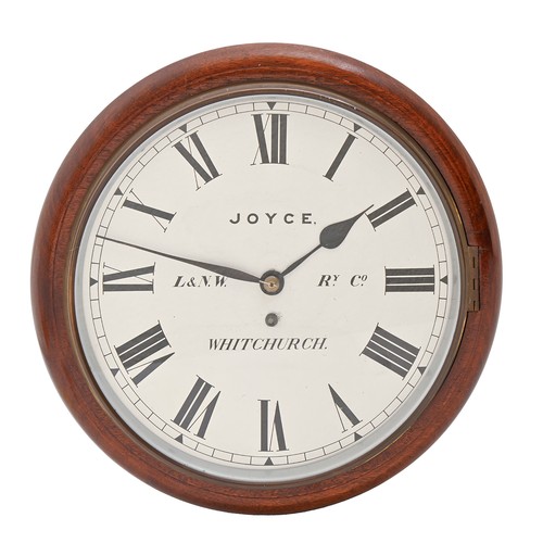 Railway clock. A mahogany wall