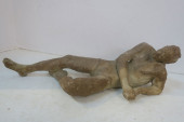 RECLINING NUDE MALE CLAY FIGUR