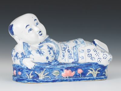Recumbent Porcelain Child Figure