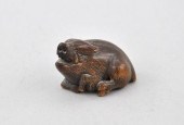 Recumbent Warthog Okimono Carv