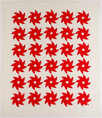 RED AND WHITE PINWHEEL QUILT,
