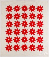 RED AND WHITE PINWHEEL QUILT,