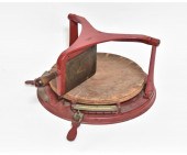 Red metal cheese cutter marked