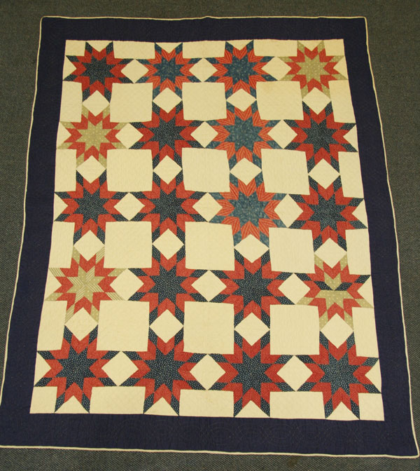 Red, white, and blue country quilt;