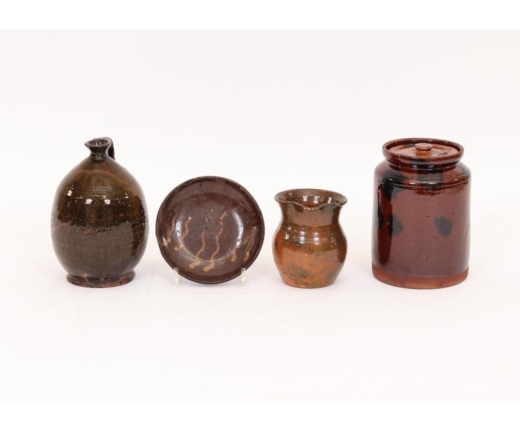 Redware ovoid jug with strap