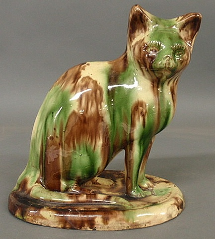 Redware seated cat with mottled