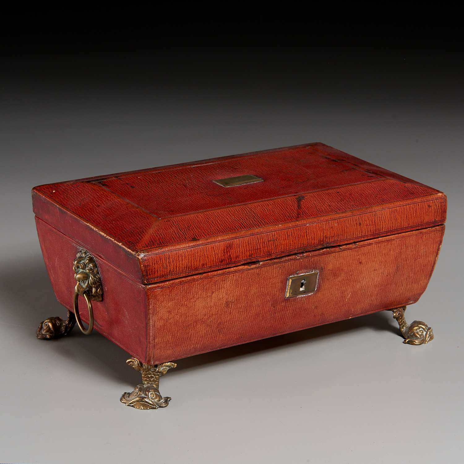 REGENCY BRASS-MOUNTED RED LEATHER