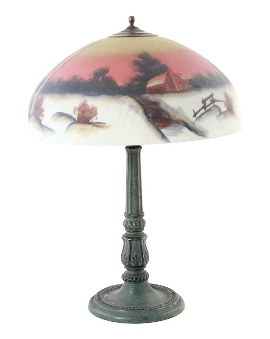Reverse-painted glass shade on lamp