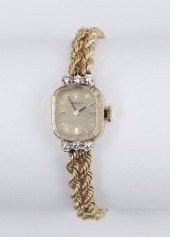ROLEX LADIES 14K GOLD AND DIAM