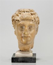 Roman marble head of man on st