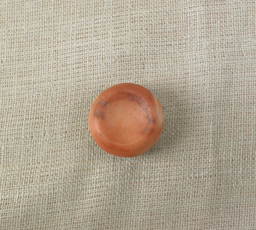 Rose quartz discoidal labeled St.