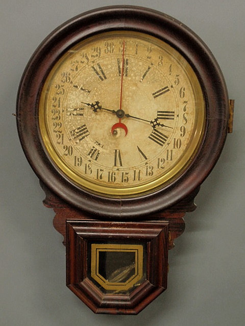 Rosewood cased calendar clock
