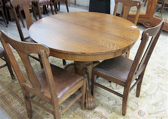 ROUND OAK DINING TABLE AND SIX
