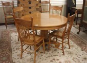 ROUND OAK DINING TABLE AND SIX